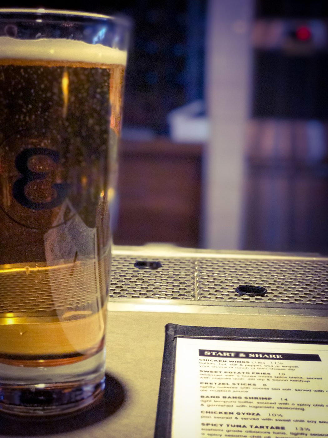 Pint glass at a bar